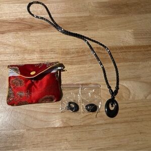 4/$25 Necklace & earring set in a pouch.Not sure of the brand